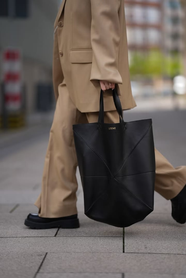 girl walking across the street in officewear