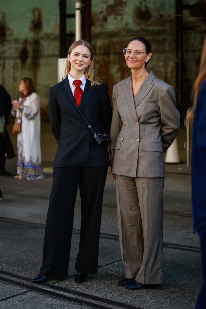 two girls in suits