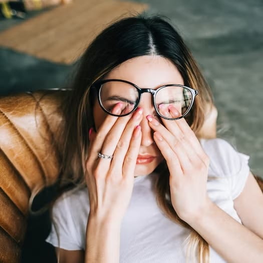 girl rubbing her eyes