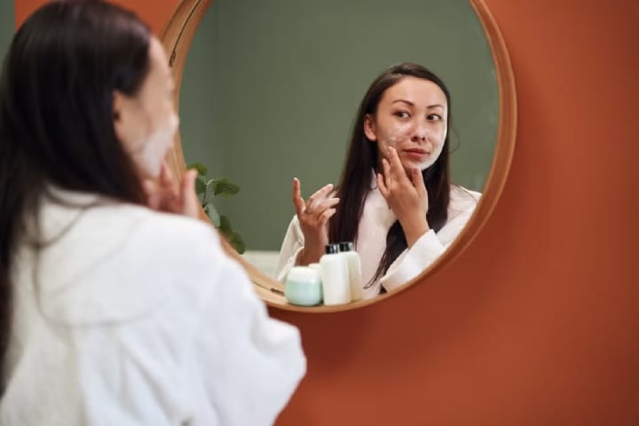 girl applying skincare