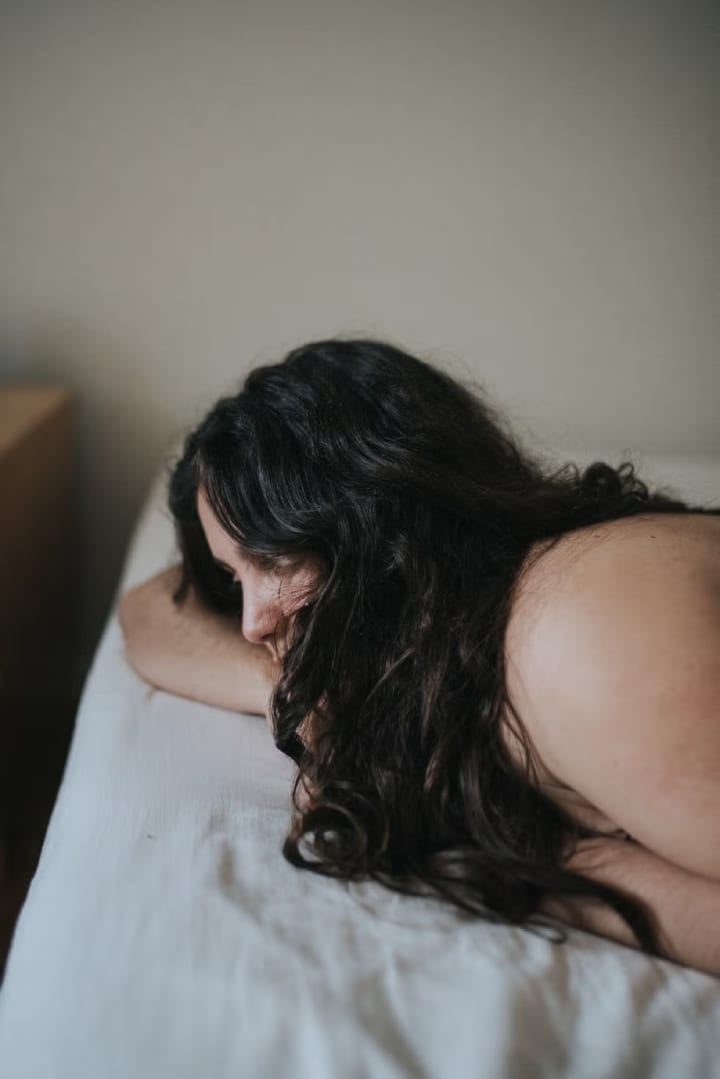 girl lying down on the bed