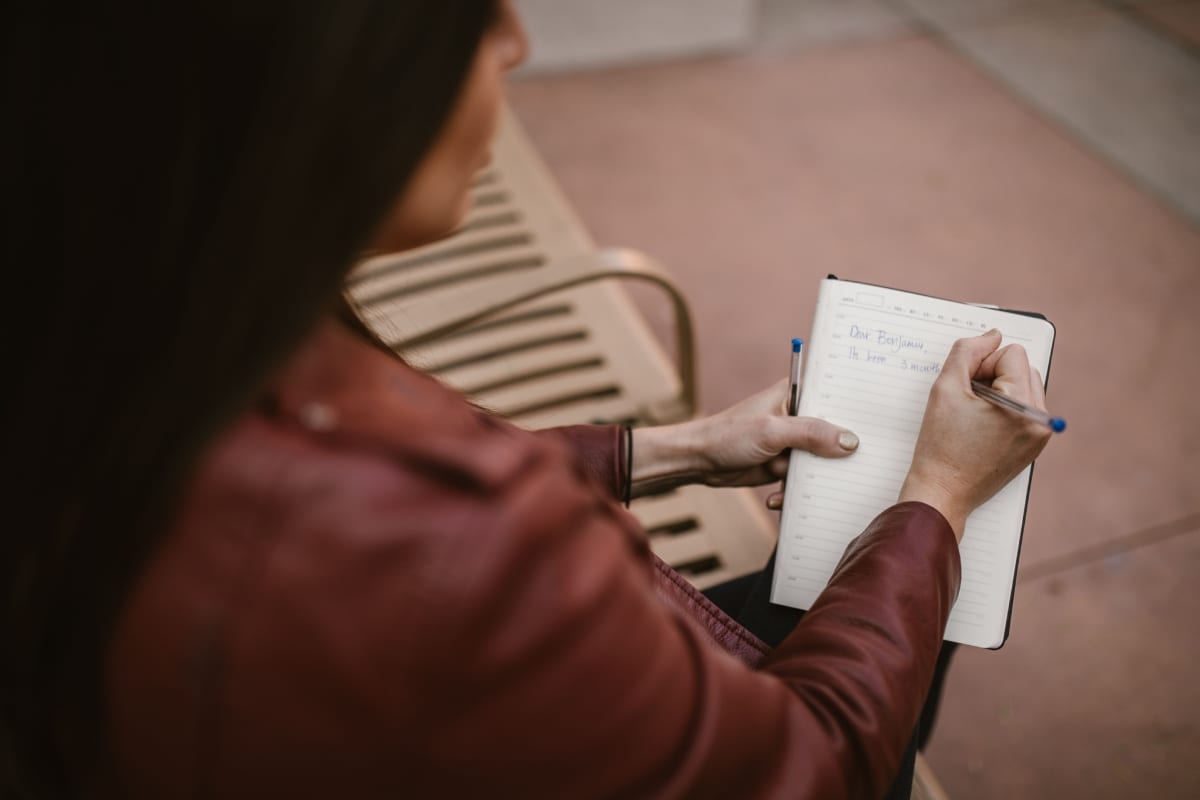 girl writing in a notebook